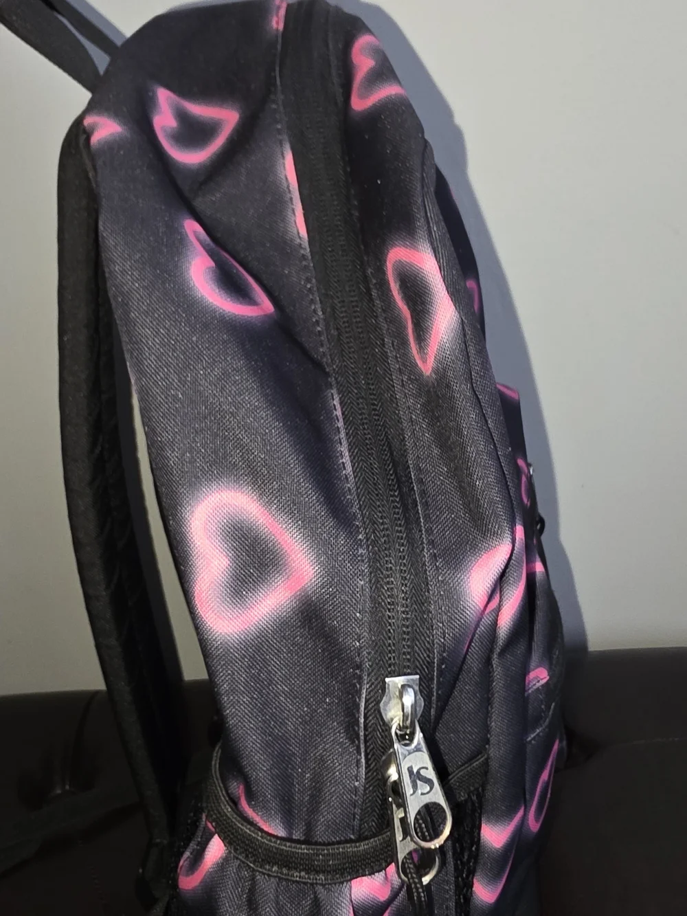 Jansport Black Backpack with Neon Pink Heart Pattern